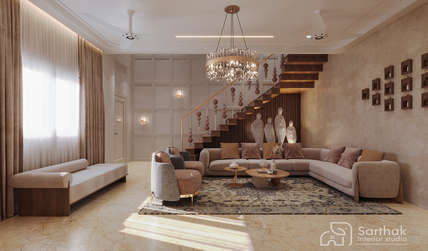 Living room with sectional sofa, staircase with beaded gold railing and sculptural figures